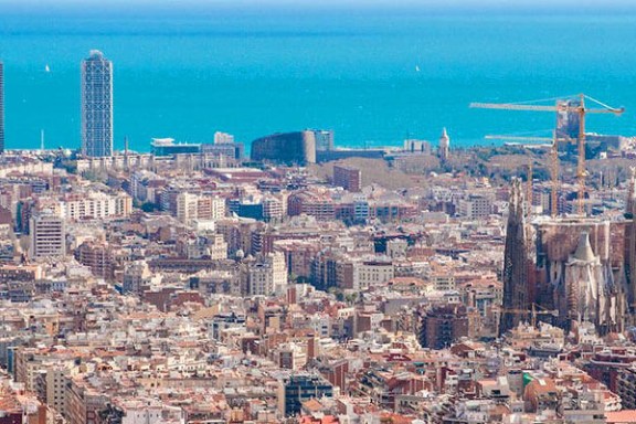 a large body of water with a city in the background