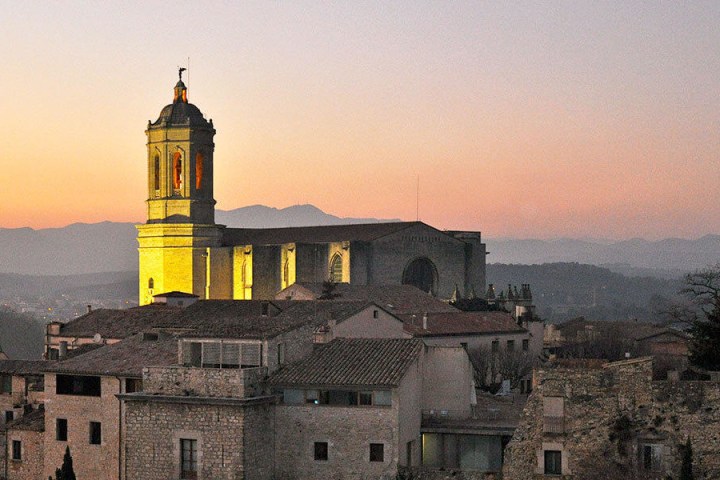 a castle with a clock tower in front of a building