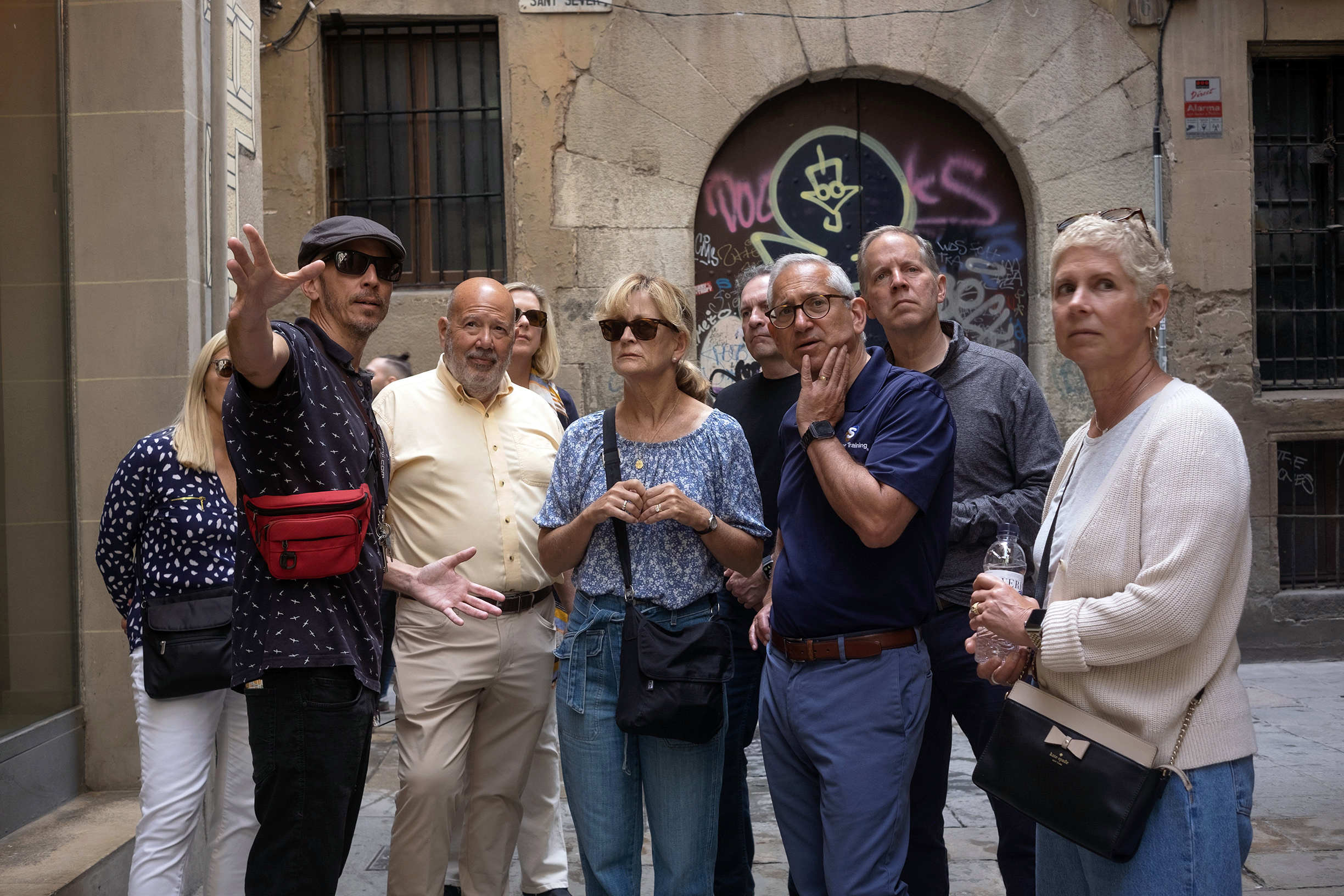 a group of people standing in front of a building