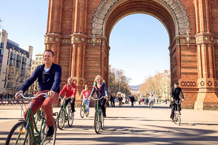 a man riding a bicycle on a city street