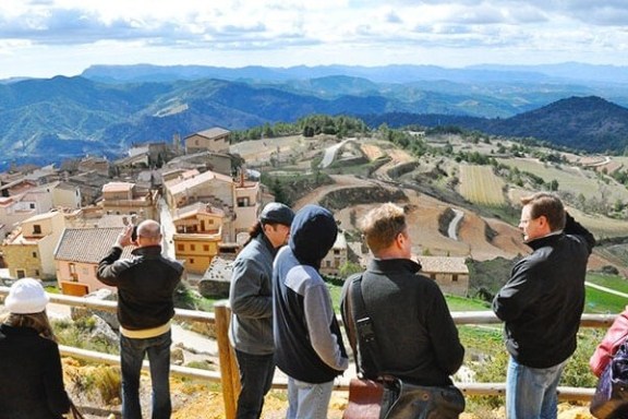 a group of people standing on top of a mountain