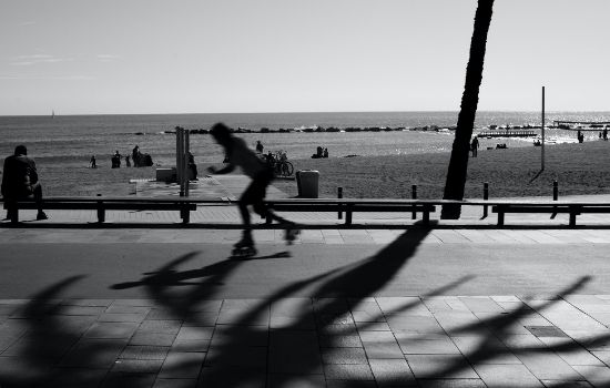 a group of people walking on a beach