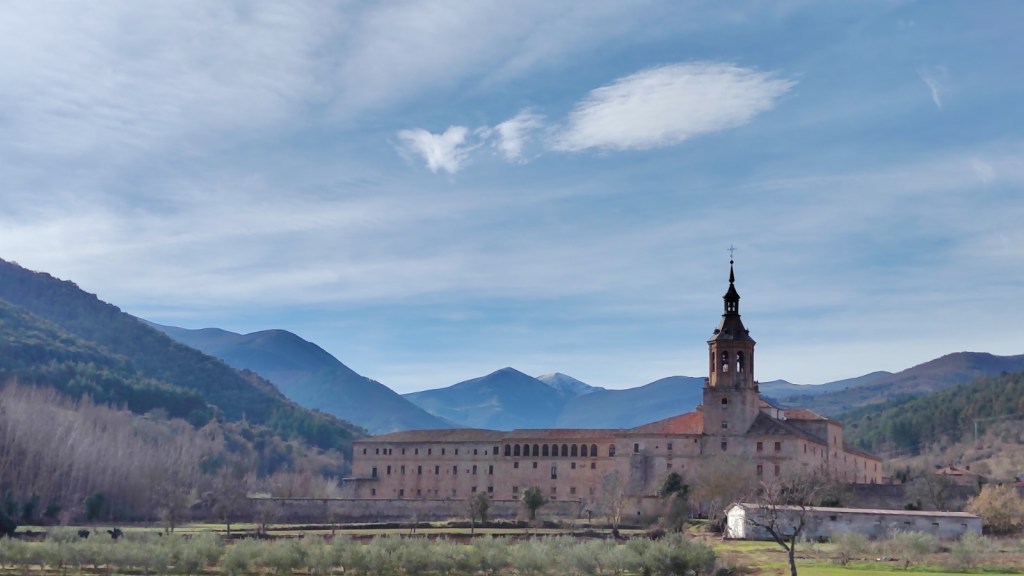 a castle with a mountain in the background