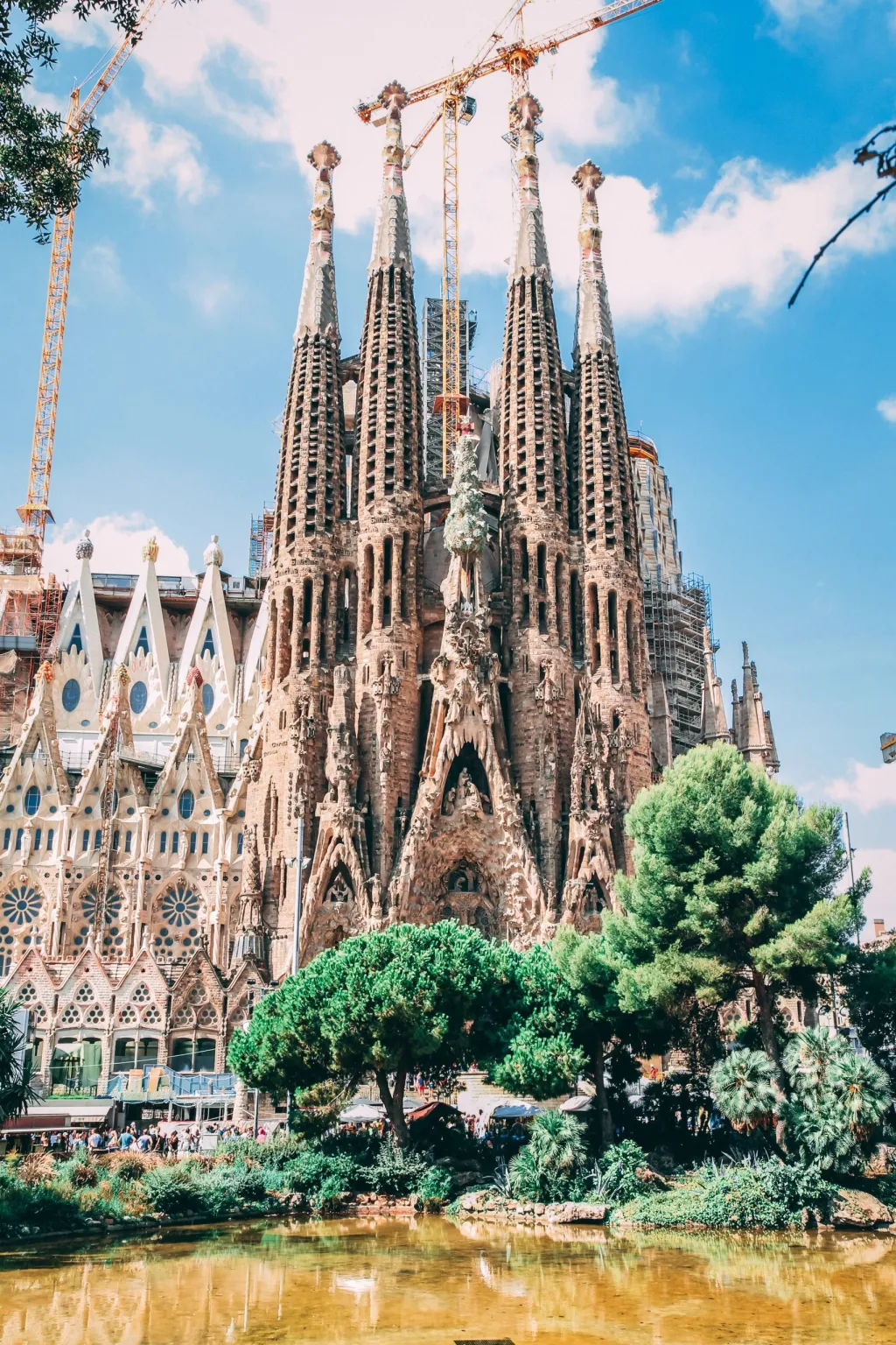 The Sagrada Família with water and trees