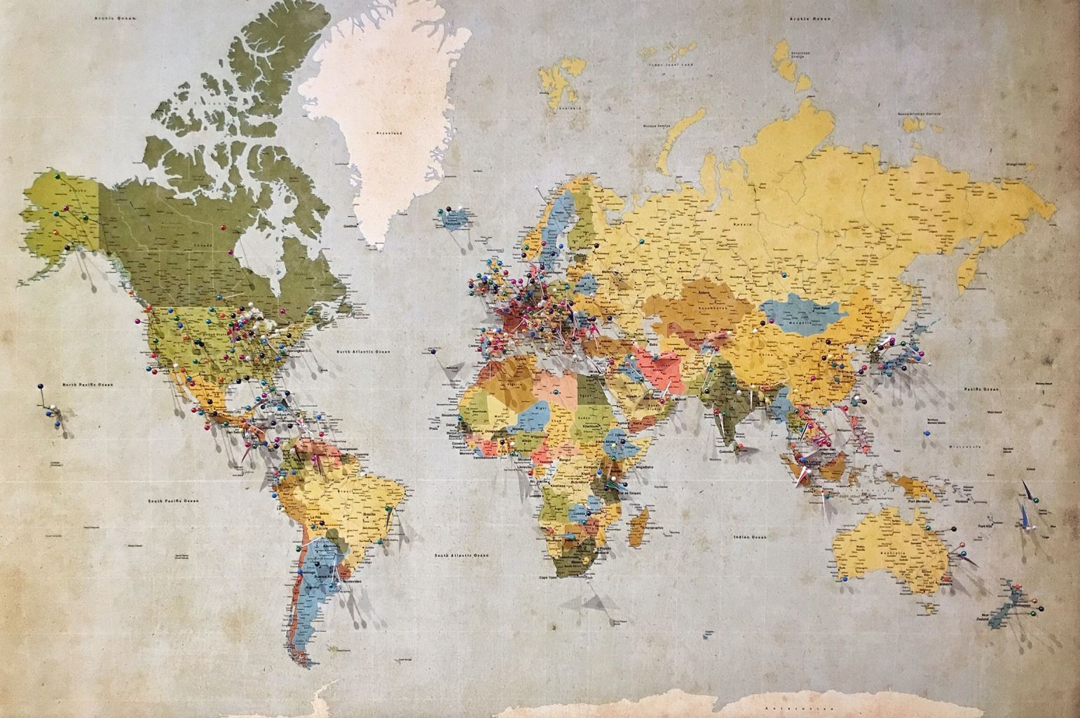 map of the world with pins in it