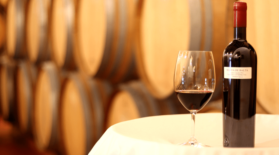 a bottle and a glass of wine