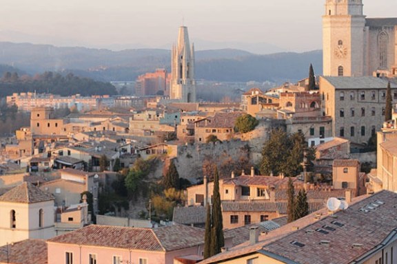 a view of a city with tall buildings in the background