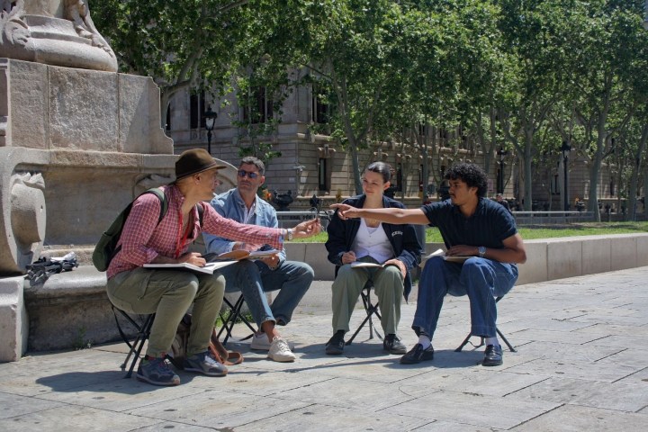 a group of people sitting on a bench