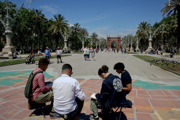a group of people sitting at a park