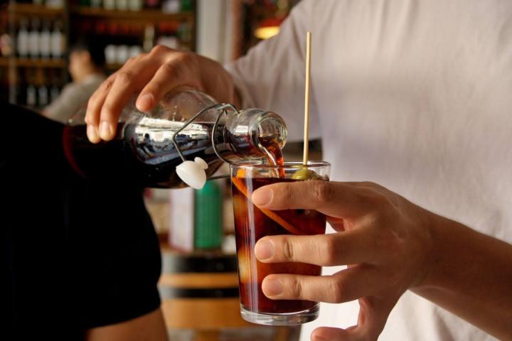 a person holding a wine glass